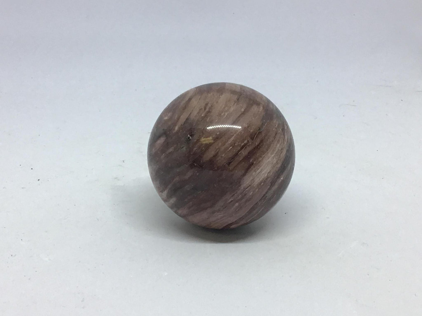 Silky banded chocolate sphere